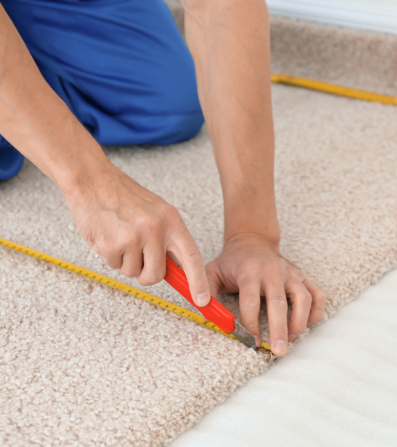 Expert AIO Remodeling Solutions team performing meticulous carpet installation and replacement. Contact us at 425-891-0663 for service details and bookings.
